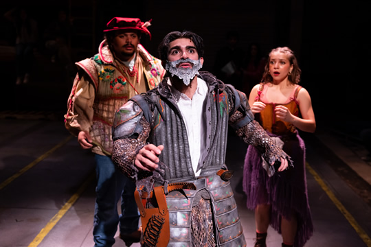 three actors performing on stage