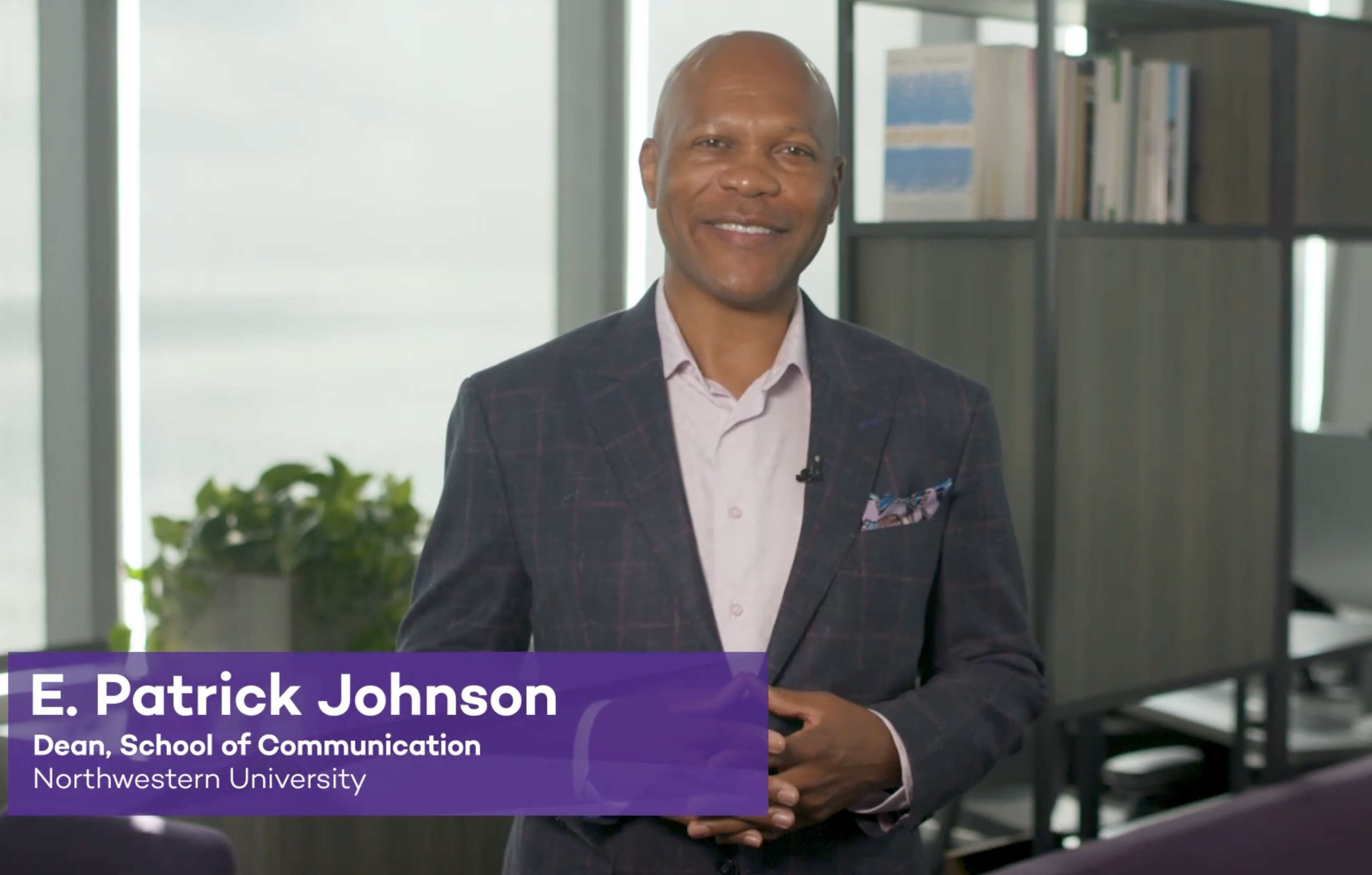 Dean E. Patrick Johnson smiles in his office