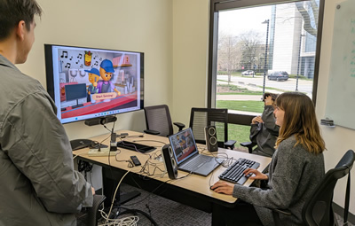 Students working on a new video game. Photo credit Stephan Moore.