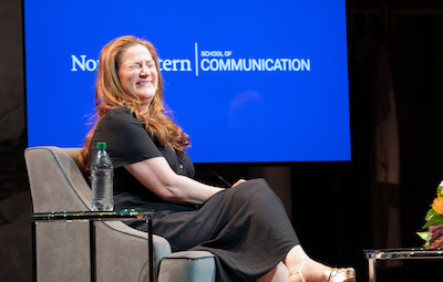 Ana Gasteyer (C89) laughing on stage